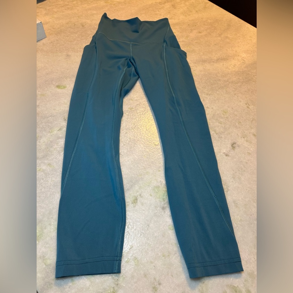 Teal Lululemon Leggings with pockets. SIZE 2